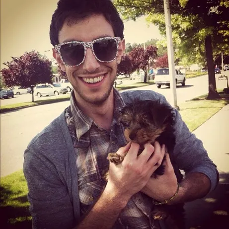 Aww, guy and his yorkie puppy