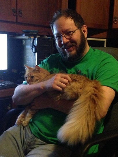 Bearded man holding cat