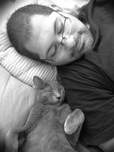 Kitty sleeping with man
