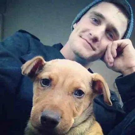 Cute guy and his puppy