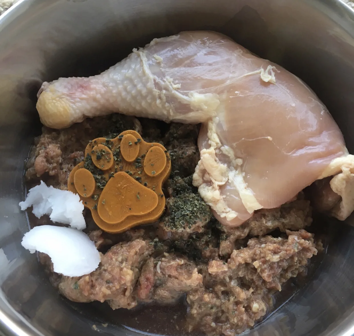 Supplements to my dog's raw diet - turmeric paste paw print