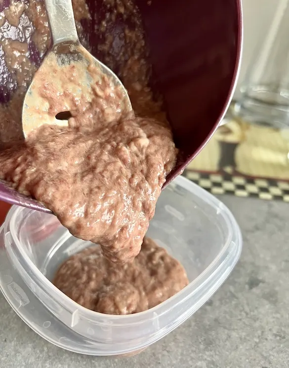 Transferring the secreting organ meat blend into a food storage container