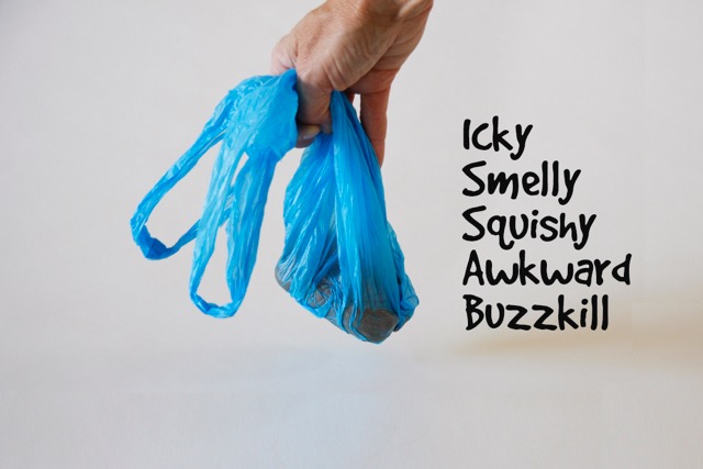 Holds used poop bags hands free